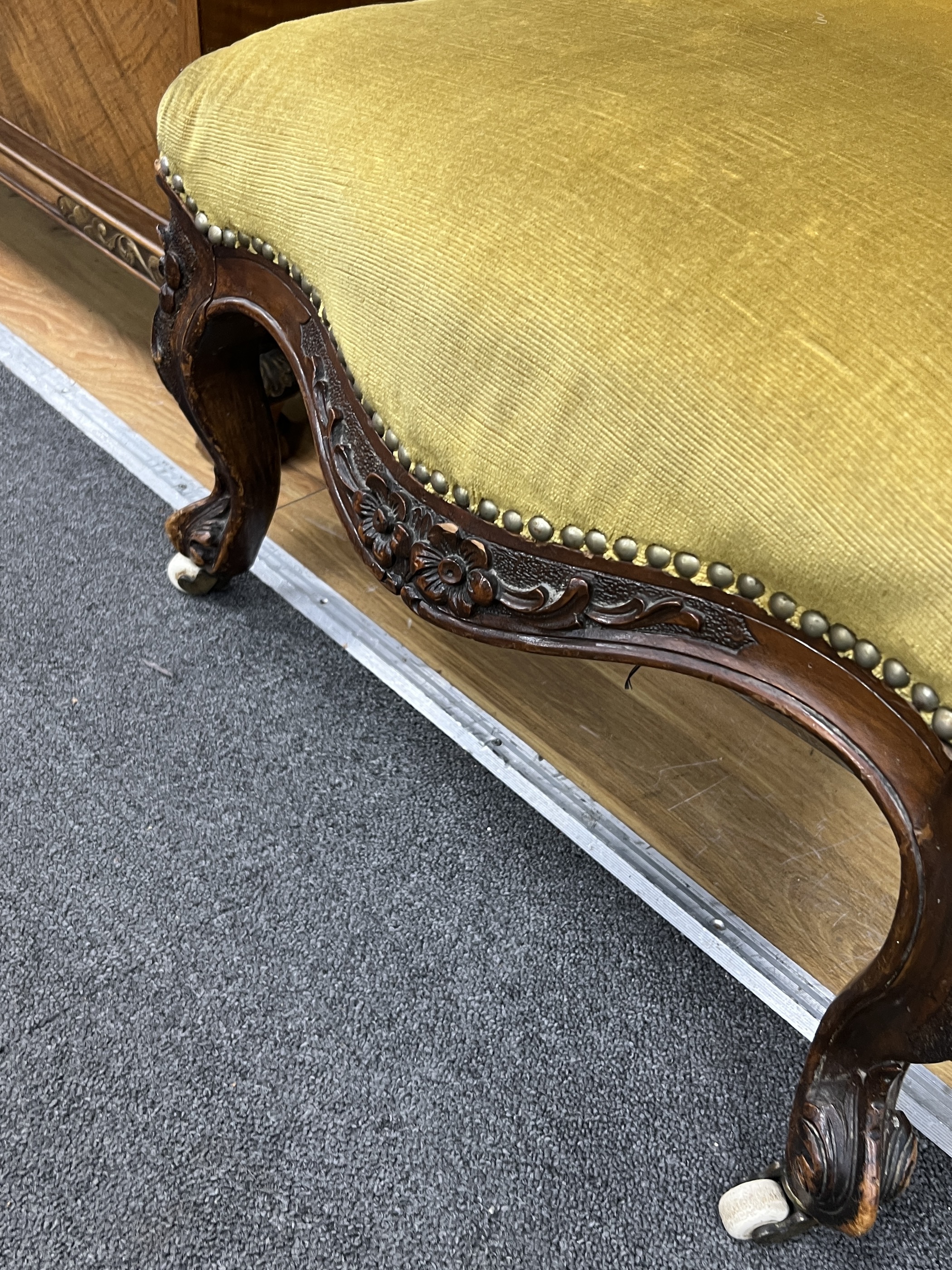 A Victorian spoonback nursing chair, width 50cm, depth 70cm, height 70cm